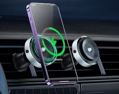 Smartphone with wireless charging icon on a car dashboard