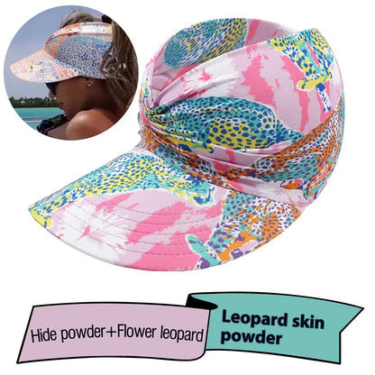 Colorful patterned visor hat with leopard skin and hide powder text on a white background