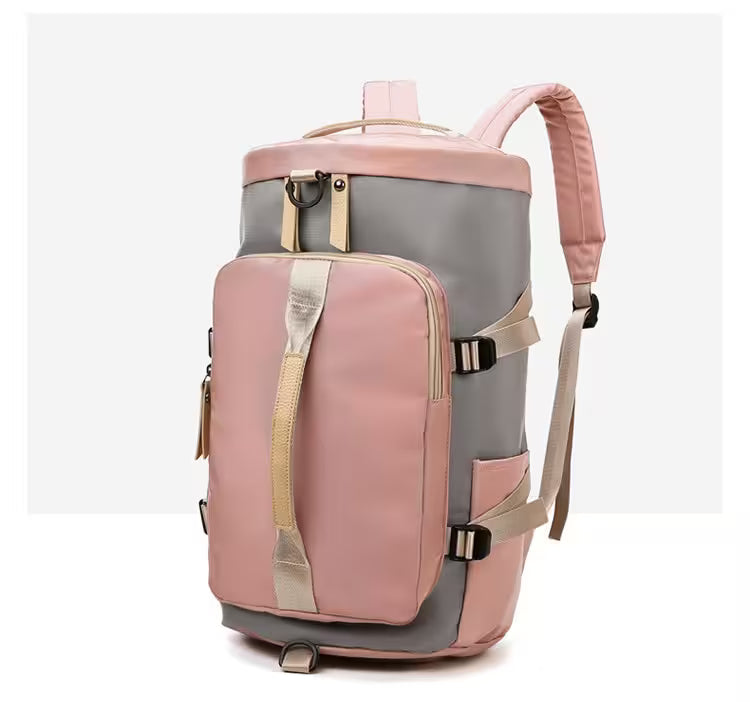 Pink and gray backpack with multiple straps on a white background