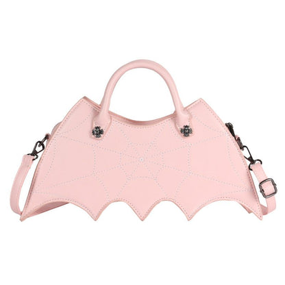 Pink bat-shaped handbag with straps on a white background