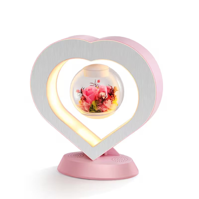 Heart-shaped lamp with a floral design on a white background