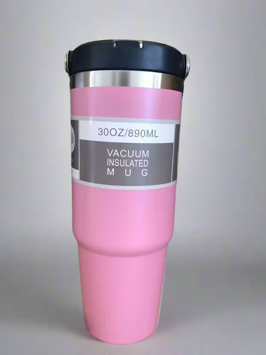 Pink vacuum insulated mug with black lid on a light gray background