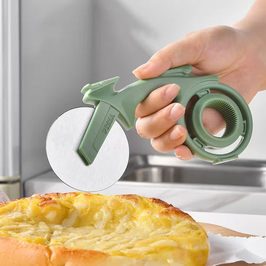 Hand using a pizza cutter to slice a pizza in a kitchen setting