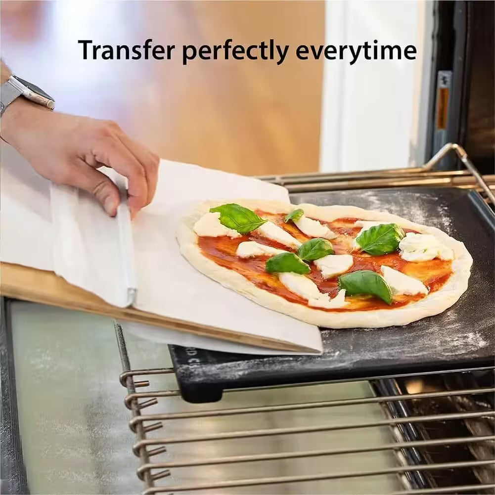 Person placing a pizza on a baking stone with text 'Transfer perfectly everytime'.
