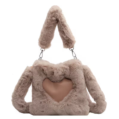 Fluffy brown handbag with bunny ears on a white background