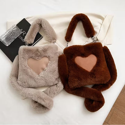 Two fluffy bags with heart designs on a white surface