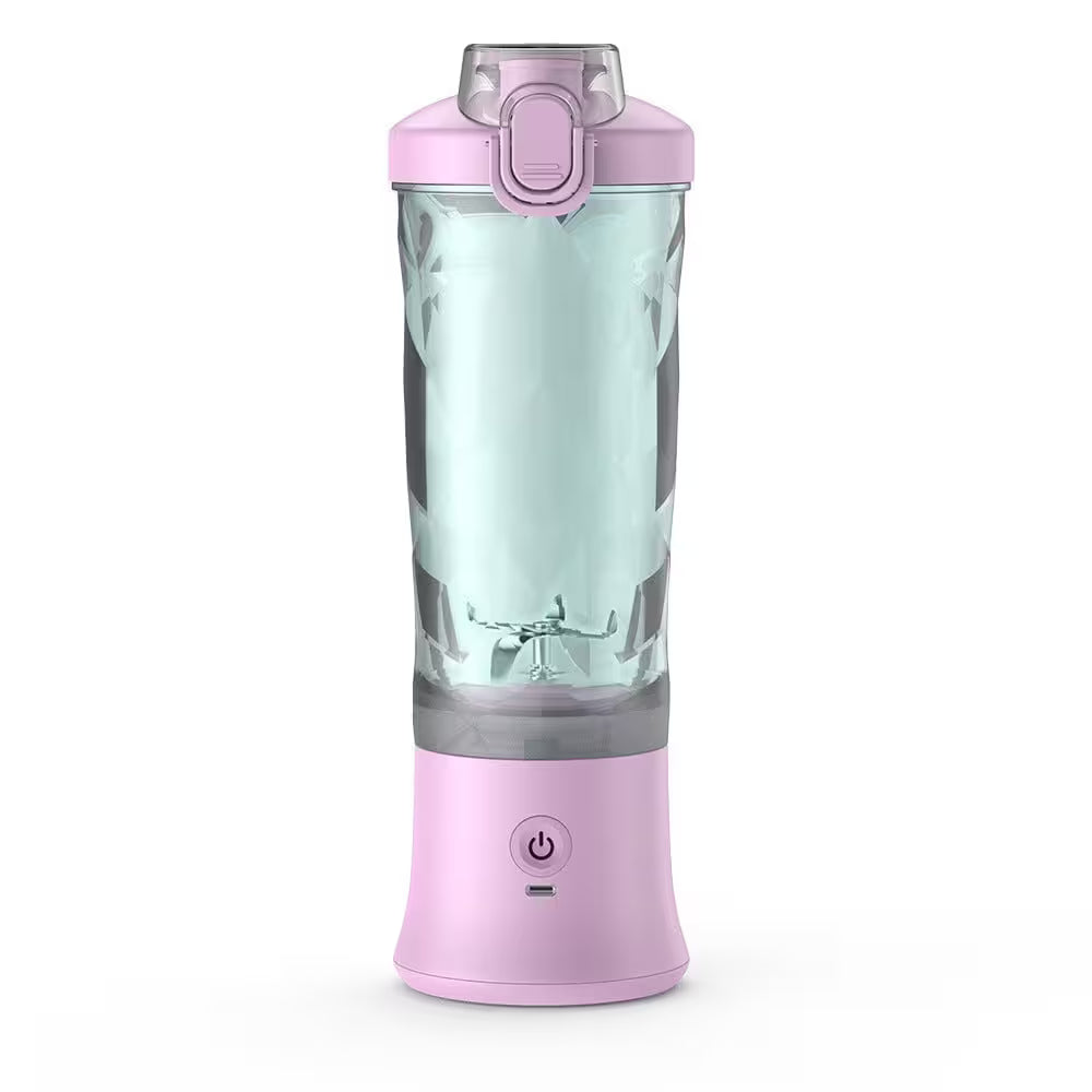 Pink portable blender with a clear container on a white background