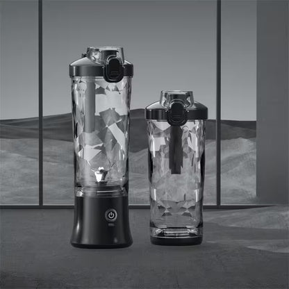 Two portable blenders with geometric patterned blades on a reflective surface.