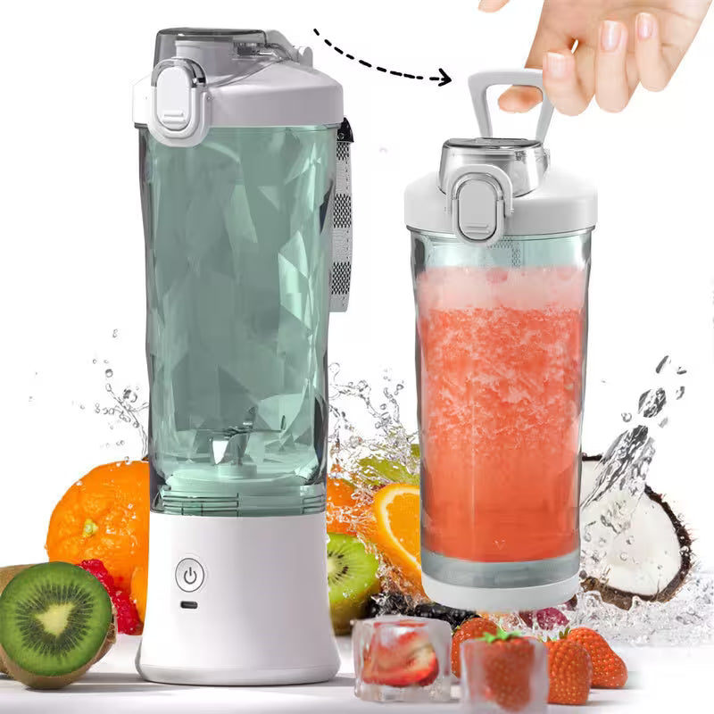 Portable blender with a hand holding a filled container, surrounded by fruits and ice cubes on a white background.