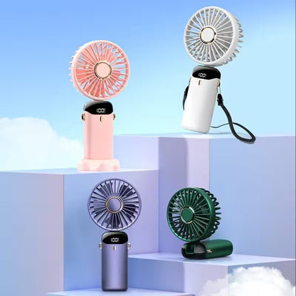 Four portable fans in different colors on a light blue background