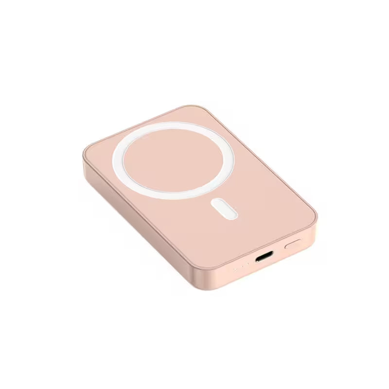 Rose gold wireless charging pad on a white background