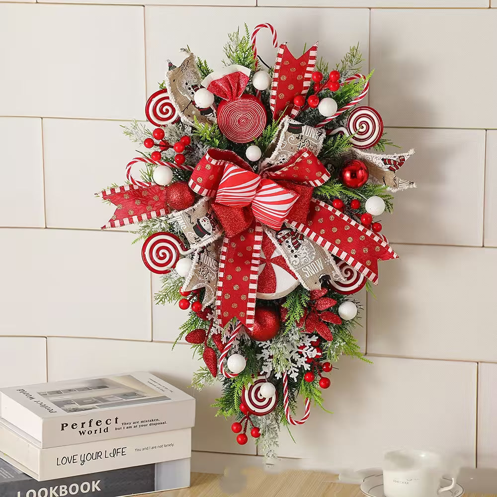Decorative Christmas wreath with red and white ornaments on a tiled wall background