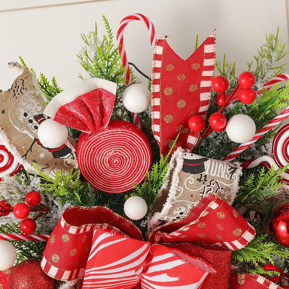 Christmas decorative arrangement with red and white ornaments, greenery, and candy canes.