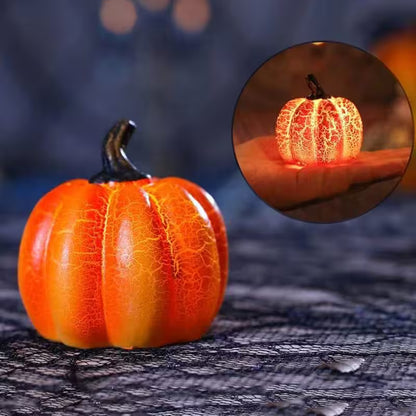 Decorative pumpkin with a glowing interior on a textured surface