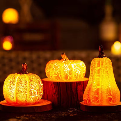Decorative pumpkins with a cracked glass effect on a dark background