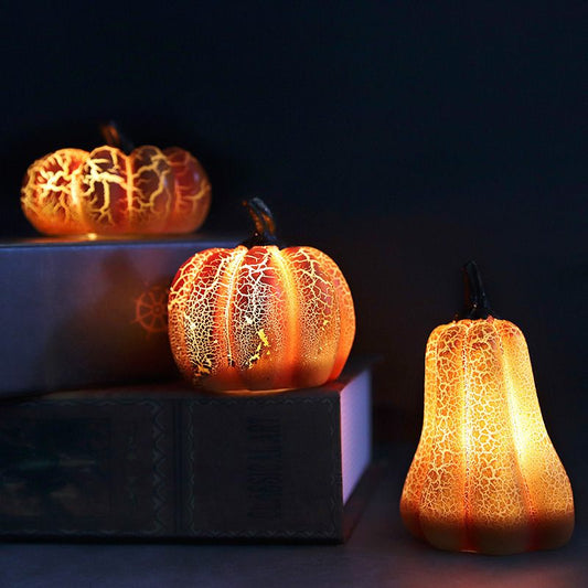 Decorative pumpkins with a textured, almost cracked appearance on a dark background