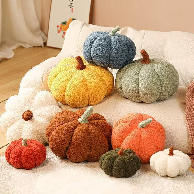 Colorful pumpkin-shaped cushions on a sofa