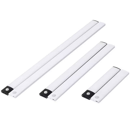 Three white LED light strips with motion sensors on a white background