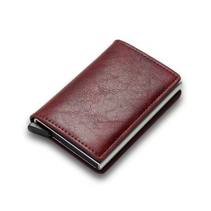 Red leather wallet with metal clip on a white background