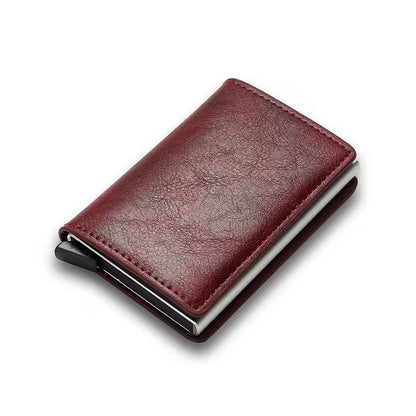 Red leather wallet with metal clip on a white background
