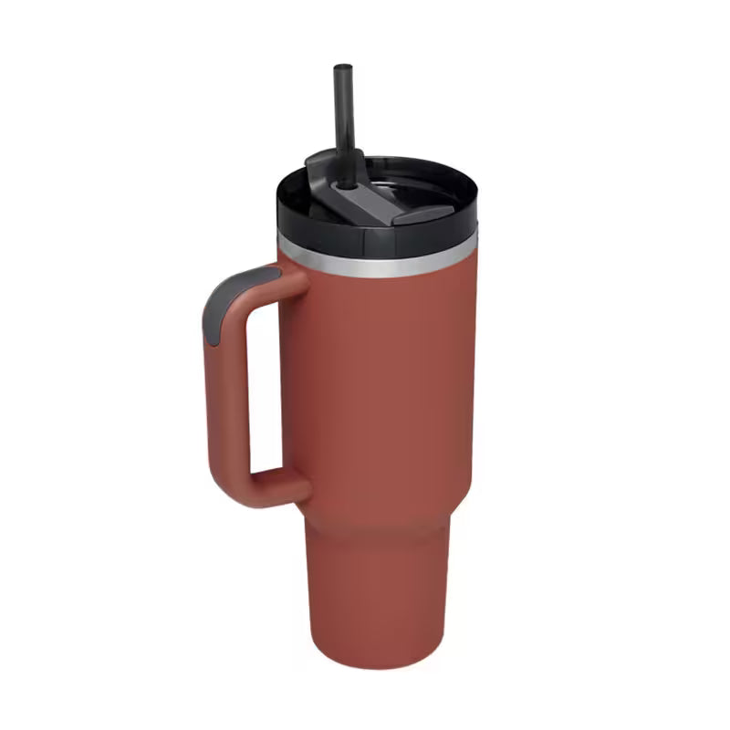 Red travel mug with a black lid and handle on a white background