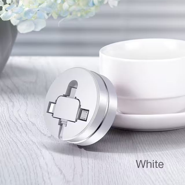 White cable with a connector on a light wooden surface with a blurred floral background