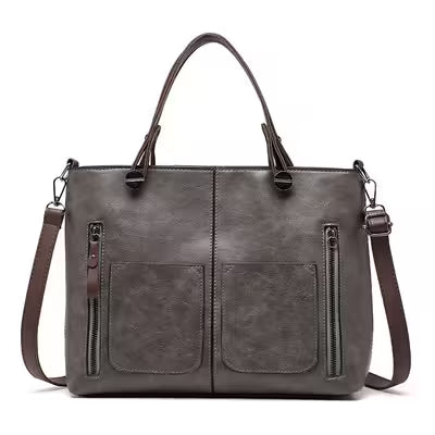 Gray handbag with brown straps on a white background