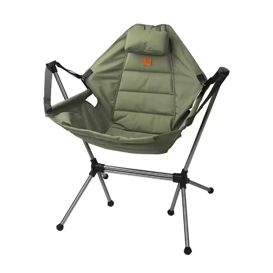 Green camping chair with a pillow on a white background