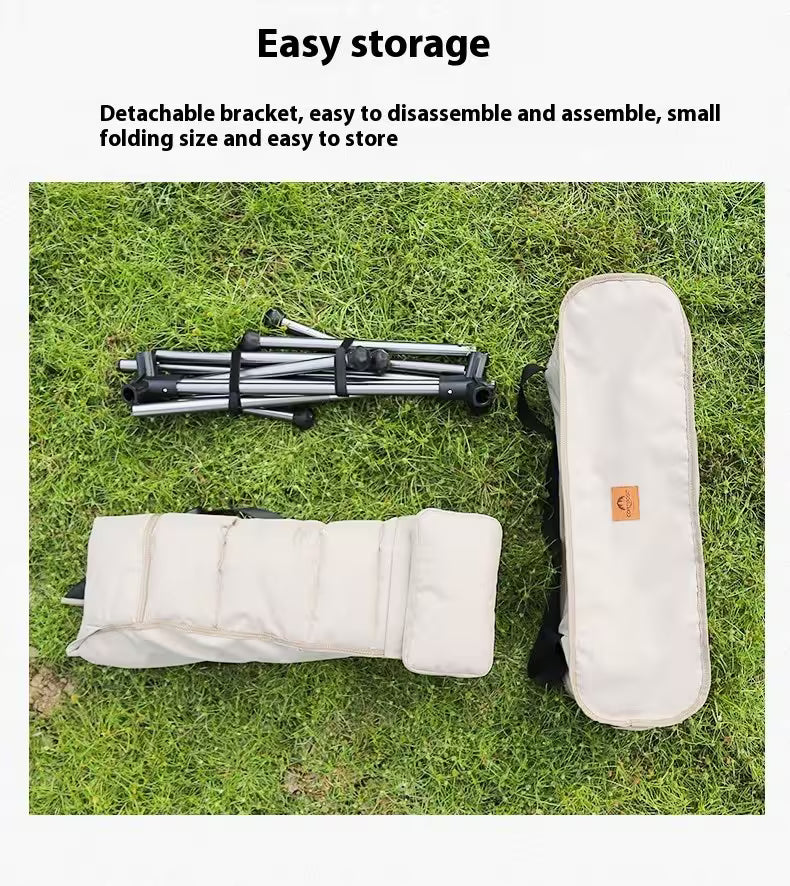 Collapsible chair with storage bag on grass, highlighting easy storage features.