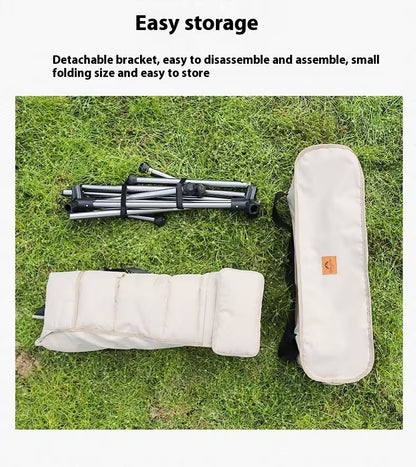 Collapsible chair with storage bag on grass, highlighting easy storage features.