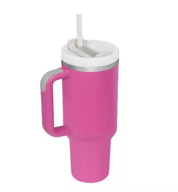 Pink tumbler with a white lid and handle on a white background