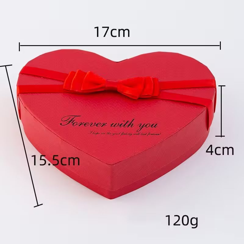 Heart-shaped red gift box with a bow and measurements on a white background