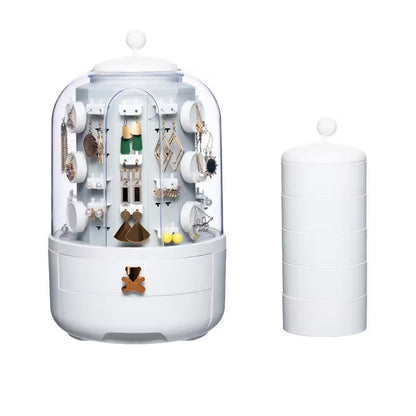 Jewelry organizer with clear dome and stacked compartments on a white background