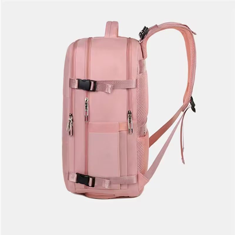 Pink backpack with multiple zippers and straps on a white background