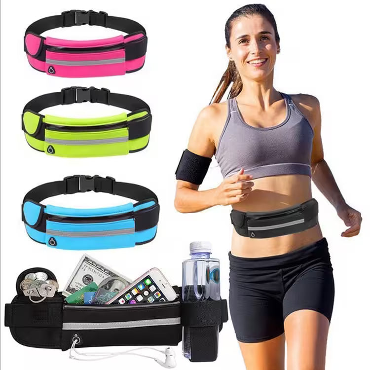 Woman wearing a black waist bag with additional waist bags and accessories displayed around her.