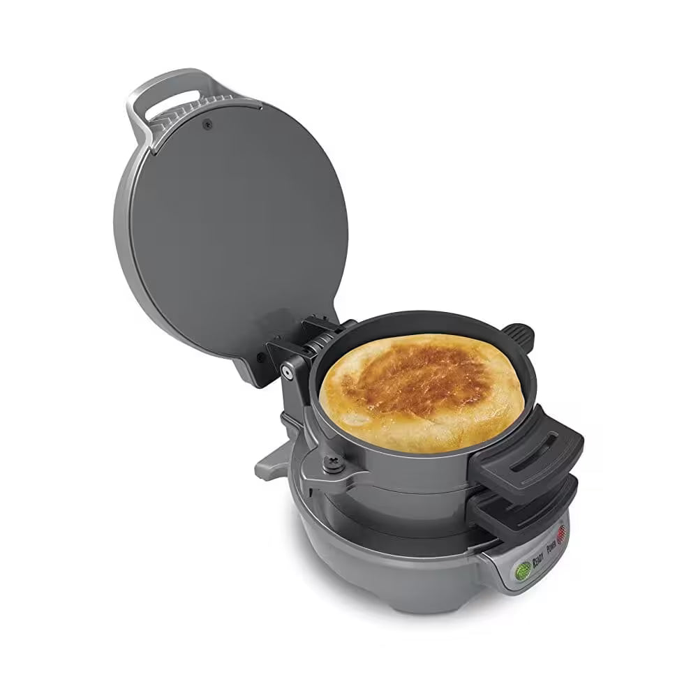 Gray waffle maker with a waffle inside on a white background