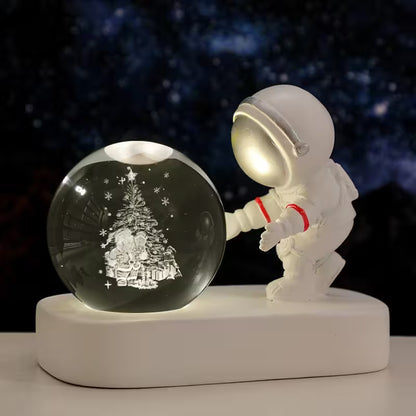Astronaut figurine interacting with a crystal ball on a dark background
