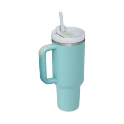 Turquoise mug with handle and straw on a white background