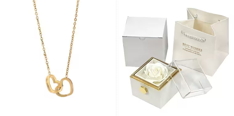 Gold necklace with interlocking rings on a white background, next to a white box with a rose inside.