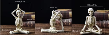 Set of three skeleton figures in yoga poses with measurements on a wooden surface.