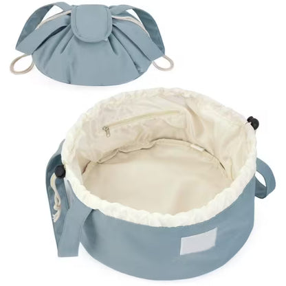 Blue pet bed with beige interior on a white background