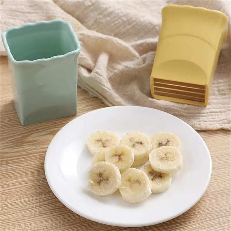 Sliced bananas on a white plate with a light blue container and yellow spoon in the background.