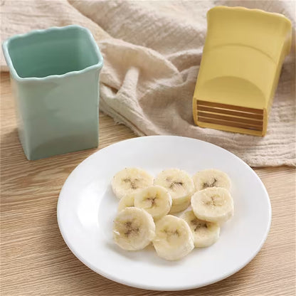 Sliced bananas on a white plate with a light blue container and yellow spoon in the background.