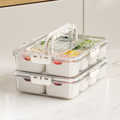 Stackable food storage containers with clear lids on a white surface