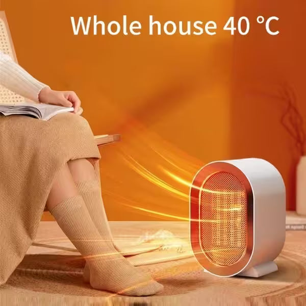 Person reading a book with a small heater emitting heat, labeled 'Whole house 40 ℃'.
