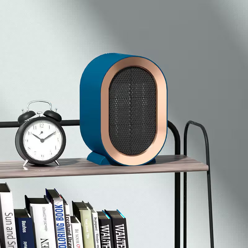 Modern blue and bronze speaker on a shelf with books and a clock