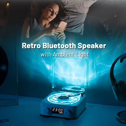 Retro Bluetooth speaker with ambient light on a table, woman using phone in background
