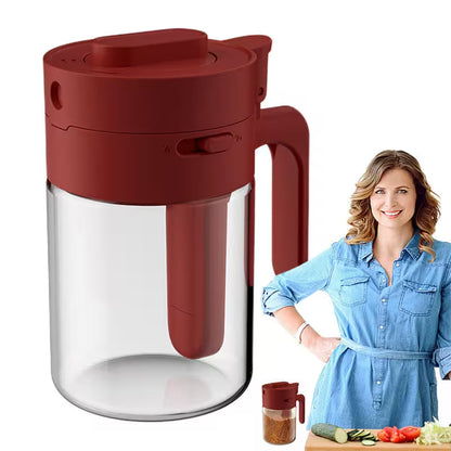 Red pitcher with a clear container on a white background, next to a woman in a kitchen.