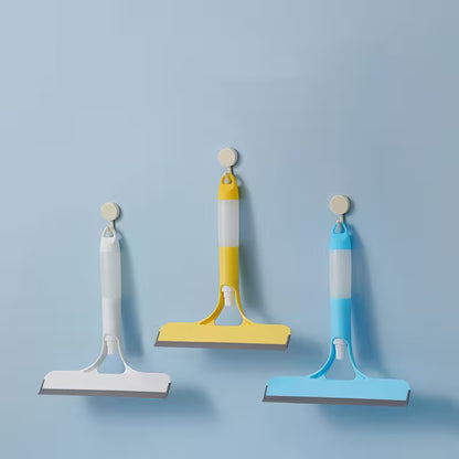 Three squeegees in white, yellow, and blue on a light blue background