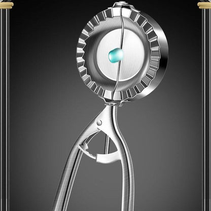 Metallic fruit peeler on a dark background